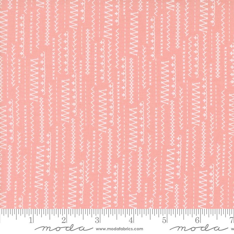 a ruler with a pink and white pattern on it