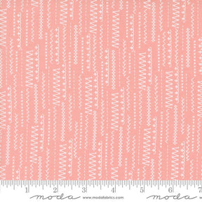 a ruler with a pink and white pattern on it