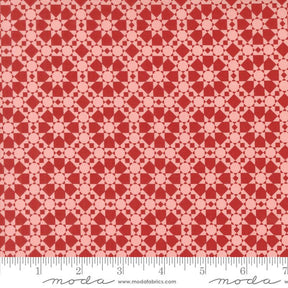 a ruler with a red and white pattern on it