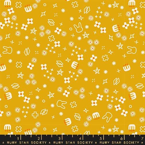 a yellow background with white stars and other symbols