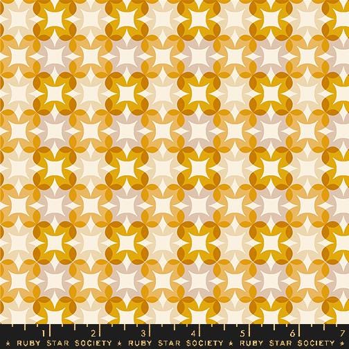 a yellow and white pattern with stars on it