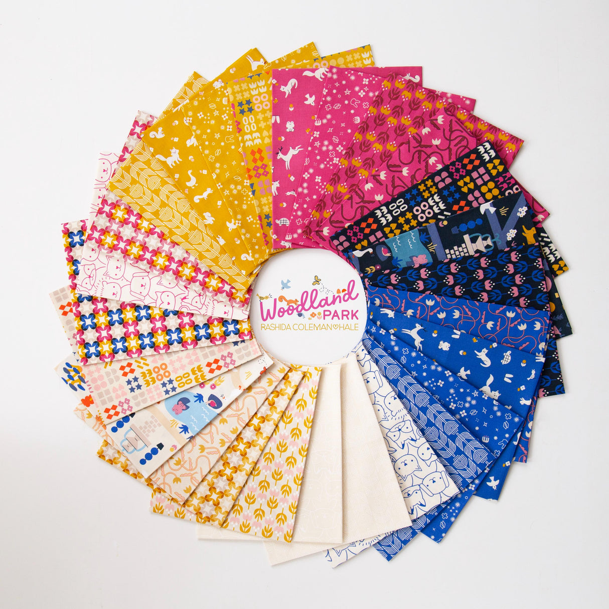 a bunch of different colors of fabric on a white surface