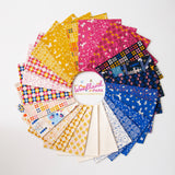 a bunch of different colors of fabric on a white surface