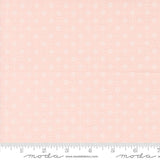 a pink background with white flowers and a ruler