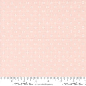 a pink background with white flowers and a ruler