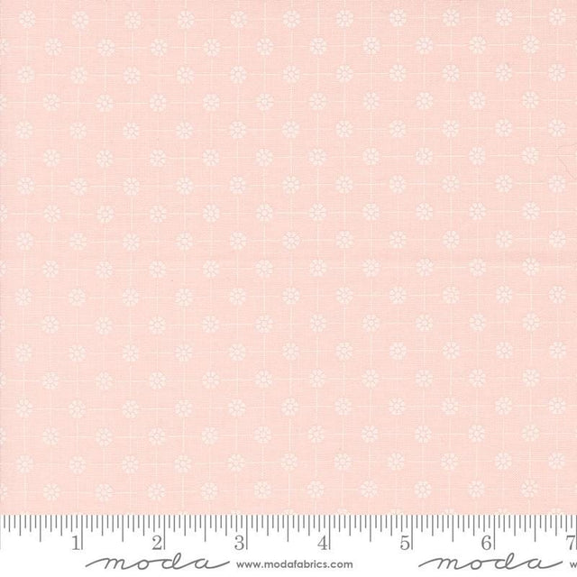 a pink background with white flowers and a ruler