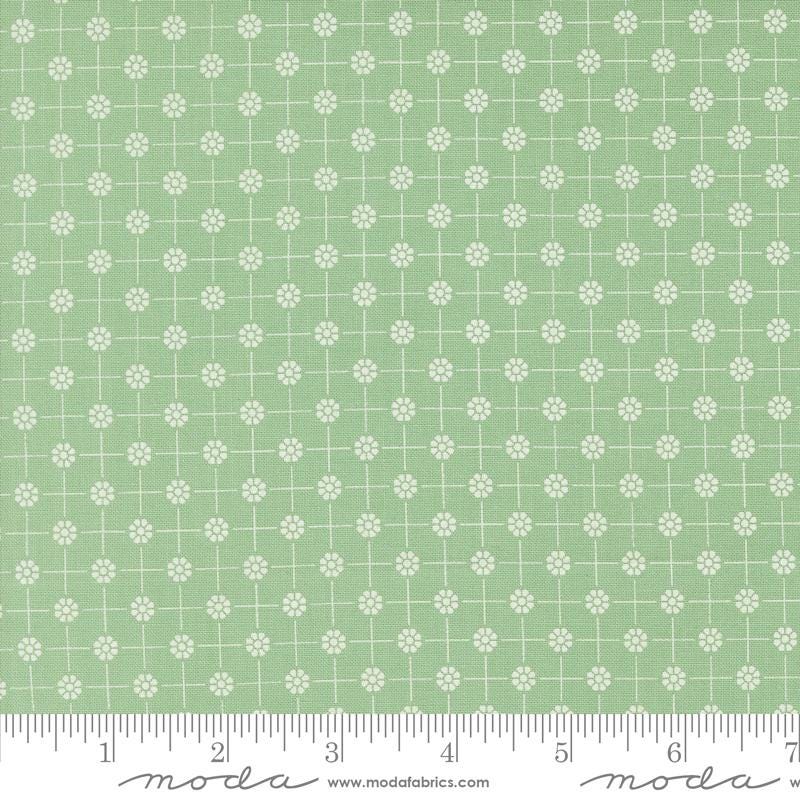 a ruler with a green and white pattern on it