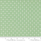 a ruler with a green and white pattern on it