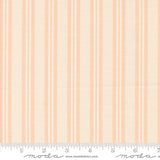 an orange and white striped fabric with a ruler