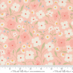 a pink flowered fabric with green leaves and flowers on it