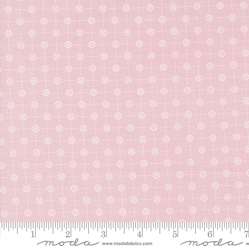 a pink background with white flowers on it