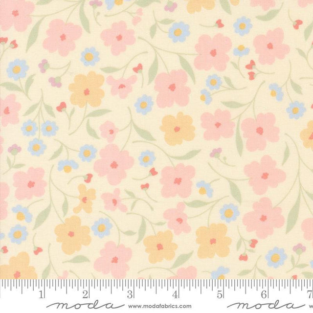 a flowered fabric with a ruler in front of it
