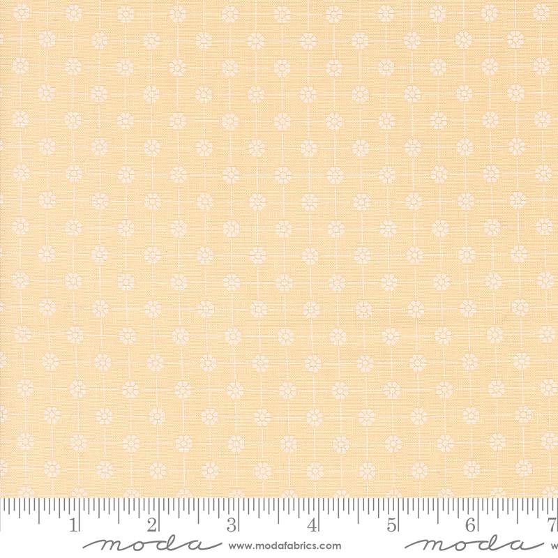 a ruler with a yellow background with white flowers
