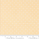a ruler with a yellow background with white flowers