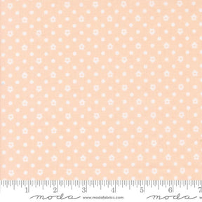 a ruler with a pink and white polka dot pattern on it