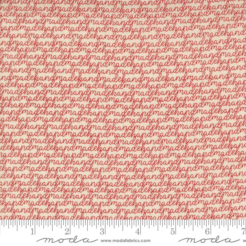 a ruler with a red and white fabric
