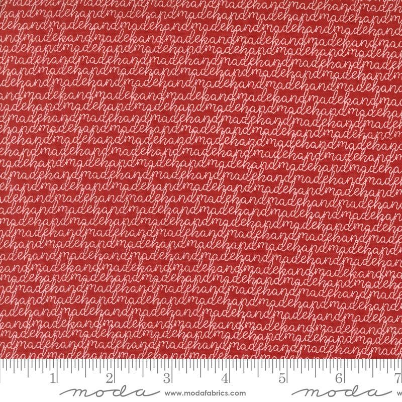 a red fabric with white letters on it