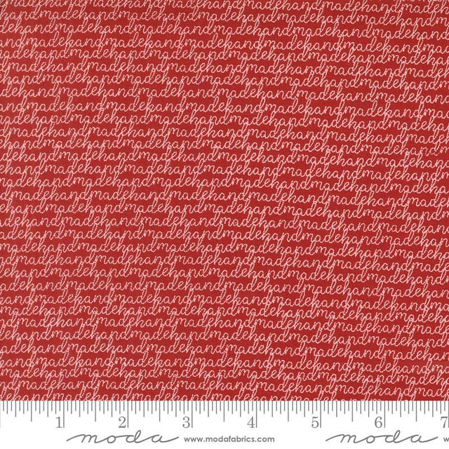 a red fabric with white letters on it