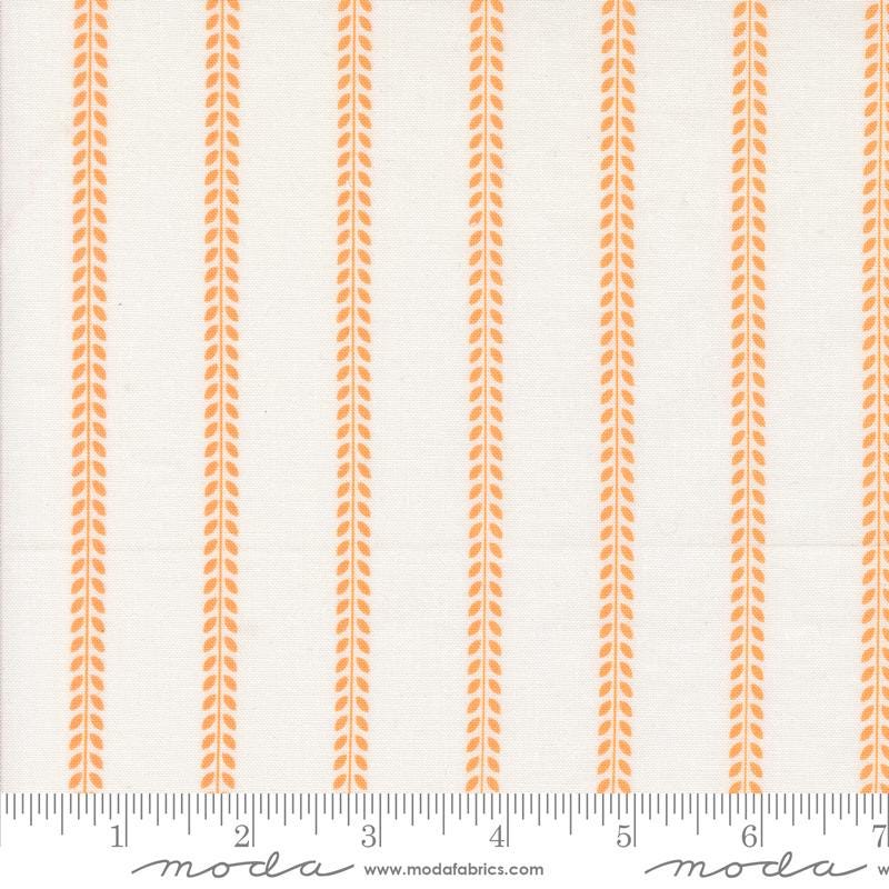 a ruler with an orange and white stripe pattern