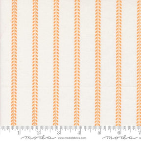 a ruler with an orange and white stripe pattern