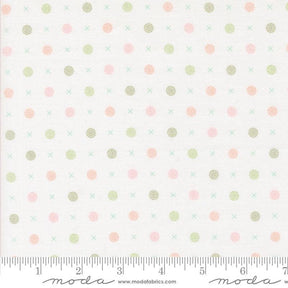a white background with pink and green polka dots