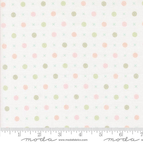 a white background with pink and green polka dots