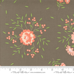 a brown background with pink flowers and green leaves
