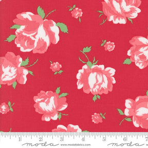a red flowered fabric with white and pink flowers