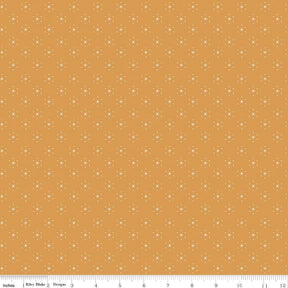 a yellow background with white dots on it