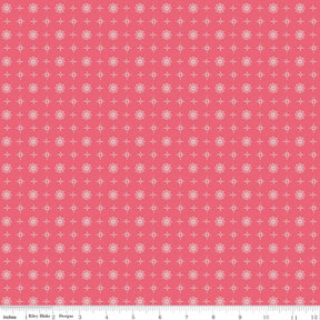 a pink background with white dots