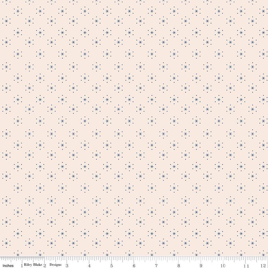 a ruler is next to a wall with a pattern on it