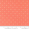 a ruler with an orange background and white dots