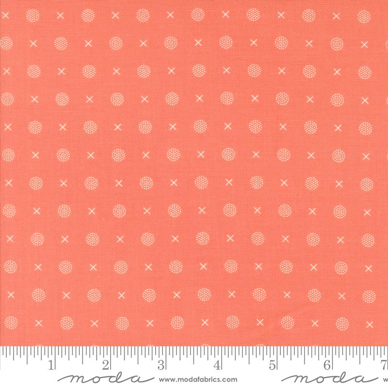 a ruler with an orange background and white dots