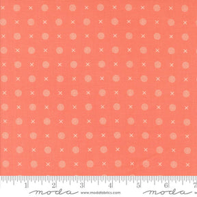 a ruler with an orange background and white dots