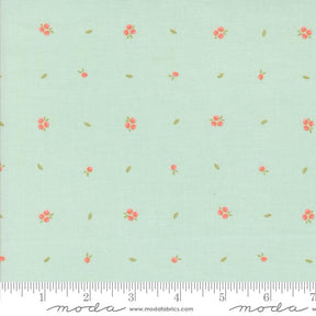 a green background with pink flowers and green leaves