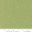 a green fabric with small pink flowers on it