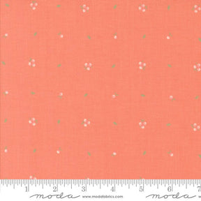 an orange fabric with small flowers on it