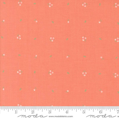 an orange fabric with small flowers on it