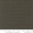 a brown and black checkered fabric with a ruler