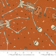 an orange background with skeletons and pumpkins