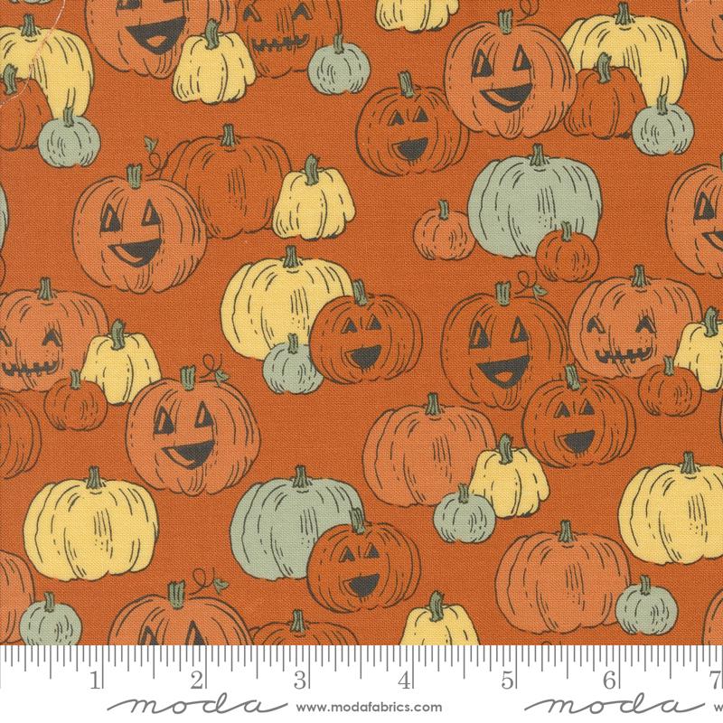 an orange background with pumpkins and faces