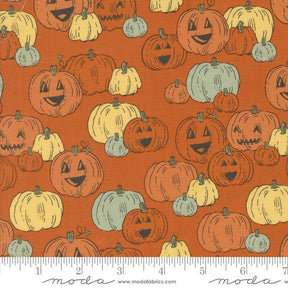 an orange background with pumpkins and faces
