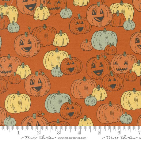 an orange background with pumpkins and faces