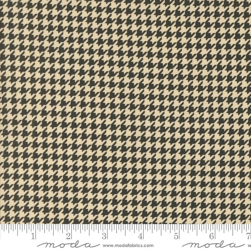 a black and white checkered fabric with a ruler