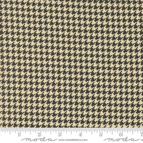 a black and white checkered fabric with a ruler