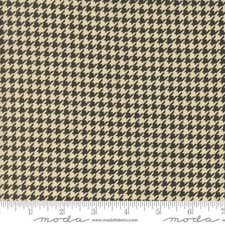 a black and white checkered fabric with a ruler