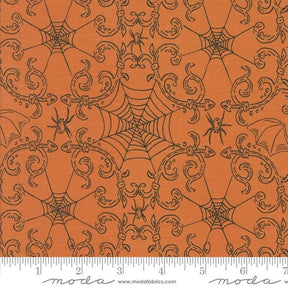 an orange background with a spider web pattern