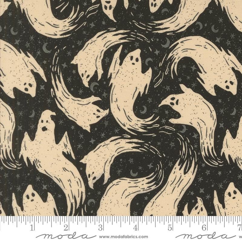 a black and white pattern with ghost faces on it