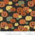 a black background with orange and green pumpkins