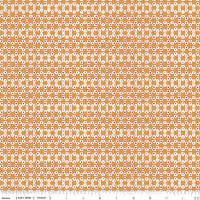 an orange and white background with a flower pattern